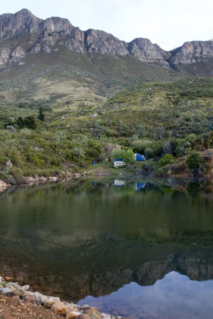 Driehoek Guest Farm campsite in Cederberg mountains at sunrise with sandstone cliffs